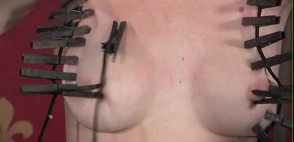  BDSM submissive tormented with wooden pegs